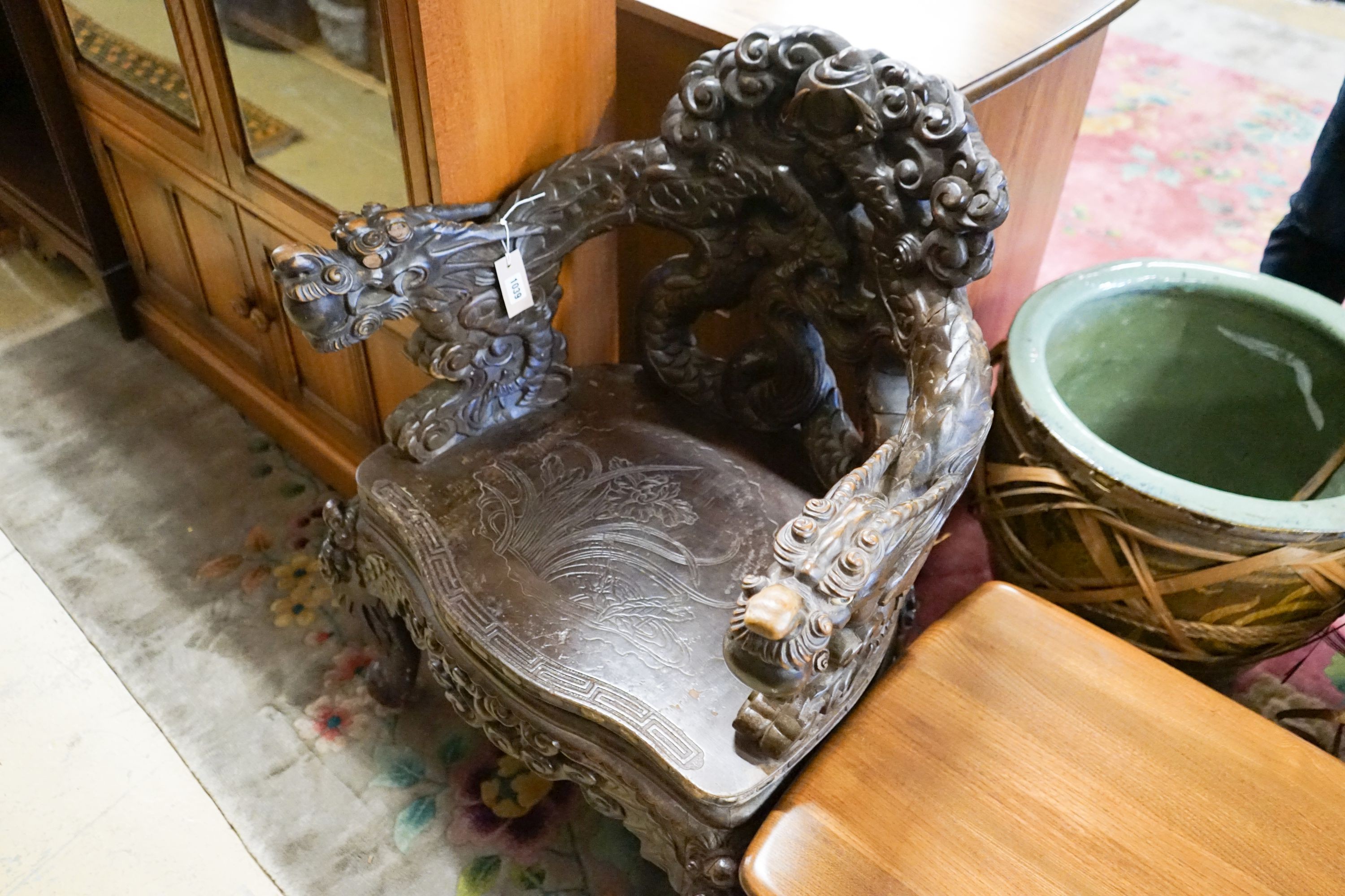 A Chinese carved hardwood 'dragon' elbow chair, width 68cm, depth 47cm, height 88cm